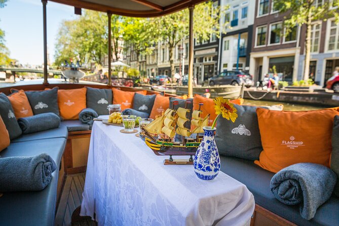 Amsterdam Canal Cruise in Classic Salon Boat With Drinks and Cheese - Pricing and Booking Details