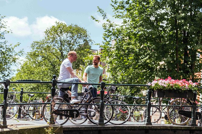Amsterdam PRIVATE Bike Tour With Locals: Bike & Local Snack Included - Local Guides Insights