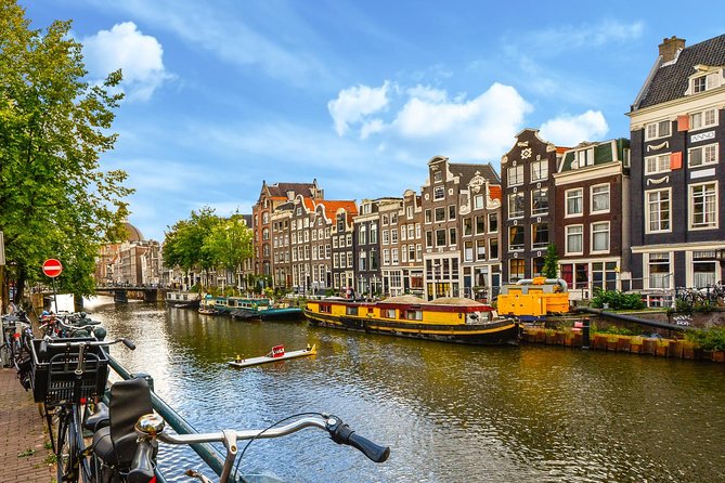 Private Tour: Amsterdam City Walking Tour and Canal Cruise - Tour Overview and Itinerary